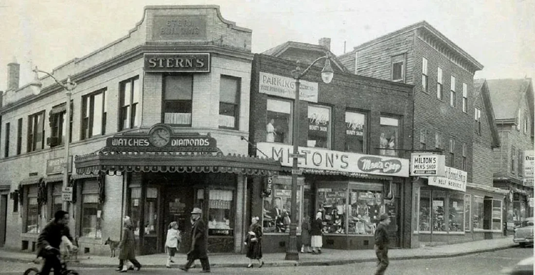The Stern Building at Freeman Square in the mid-1900s — Stern's Watches & Diamonds on the corner, with shoppers along the street