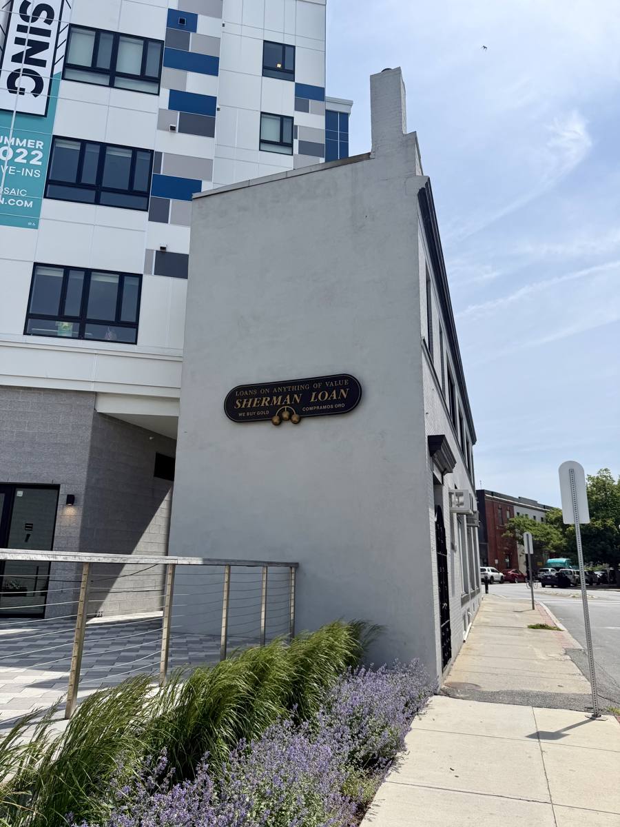 Side view of the Sherman Loan building along the sidewalk in downtown Lynn